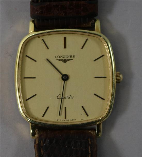 A gentlemans gold plated and steel Longines quartz watch.